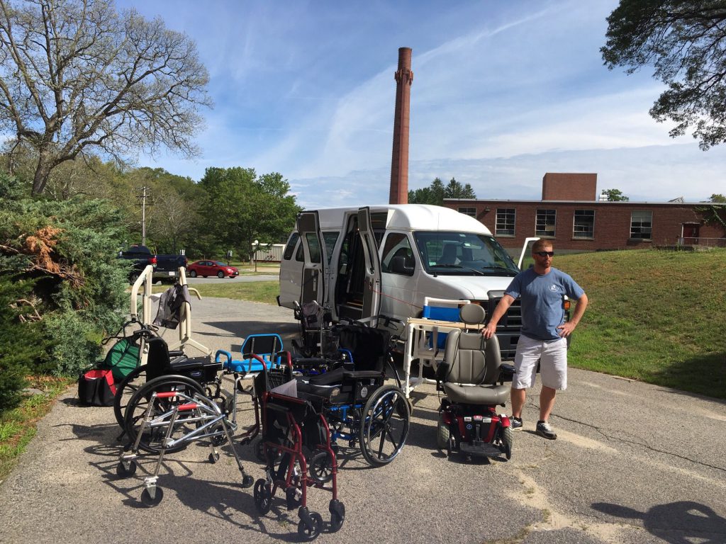staff member picking up equipment