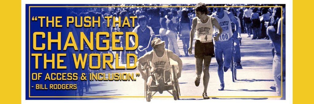 A man racing in a wheelchair next to a man running, both wearing bibs for the Boston Marathon, a crowd behind. Text reads, "The push that changed the world for access and inclusion" attributed to Bill Rodgers.