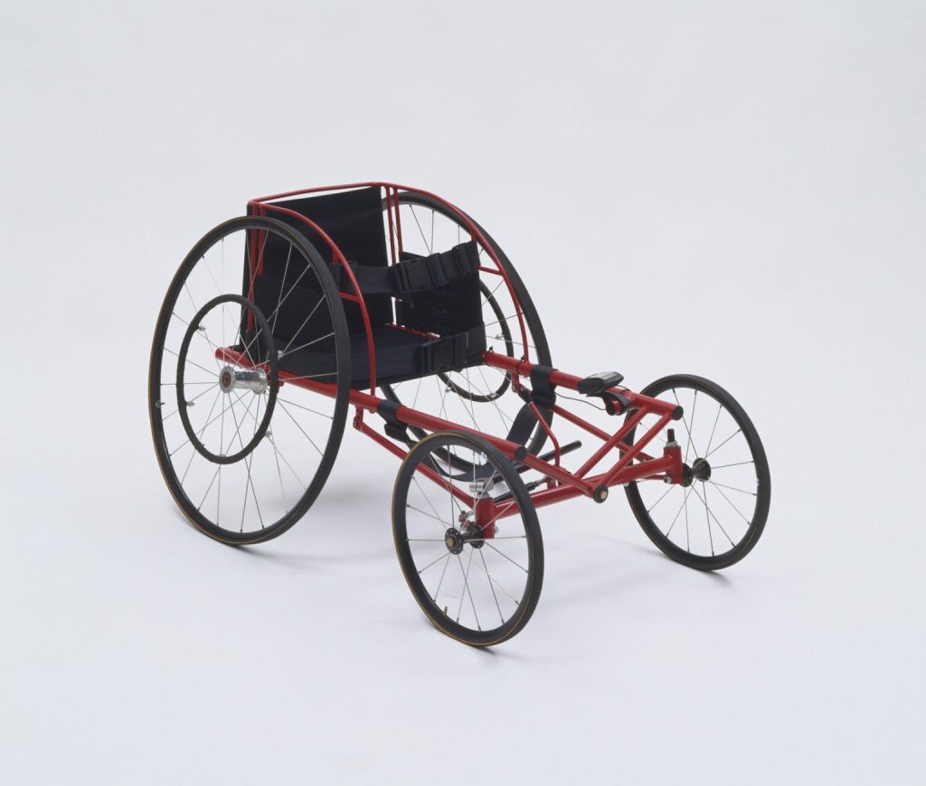 An early racing chair photographed as a museum piece.