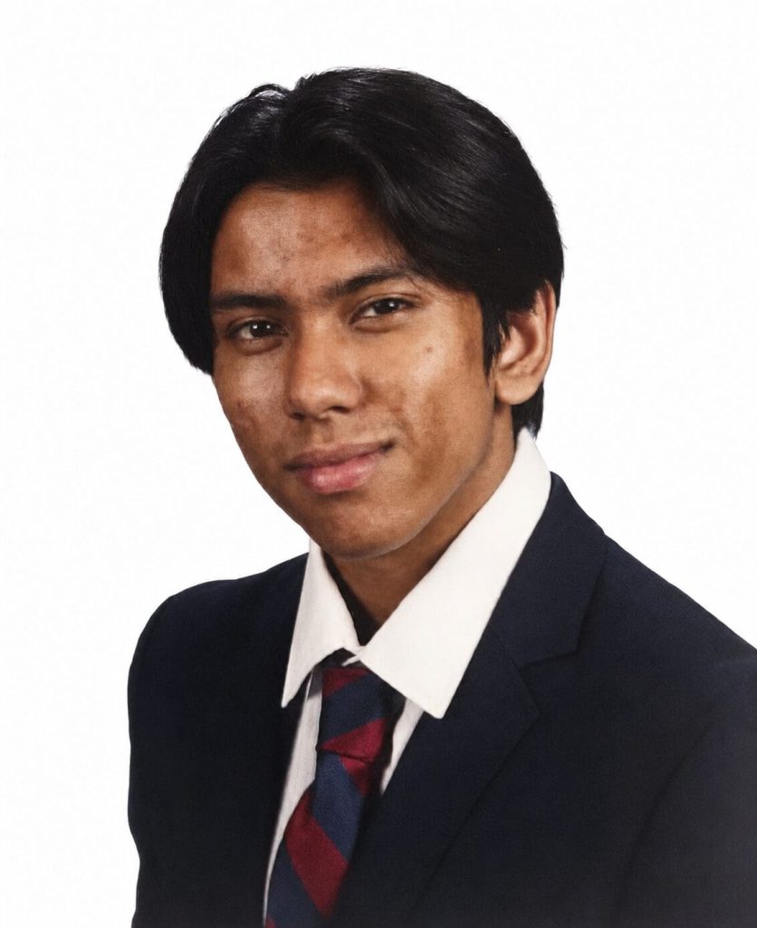 School portrait of a young man in a suit jacket and tie.